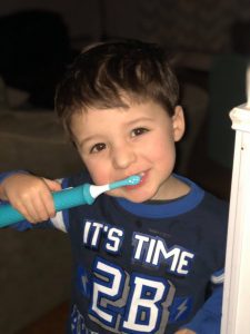 Child brushing teeth