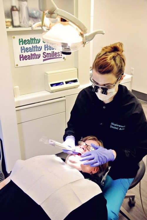 Dentist working on patient with periodontal disease. 