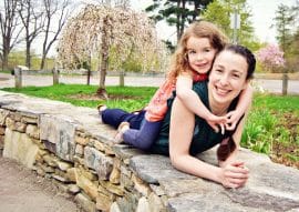 Happy girls on a rock wall